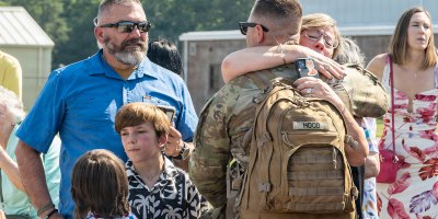 Connecticut National Guard Soldier assigned to 643rd Military Police Company, reunites with his family after returning from deployment at Bradley Air National Guard Base, East Granby, Connecticut, July 11, 2026.