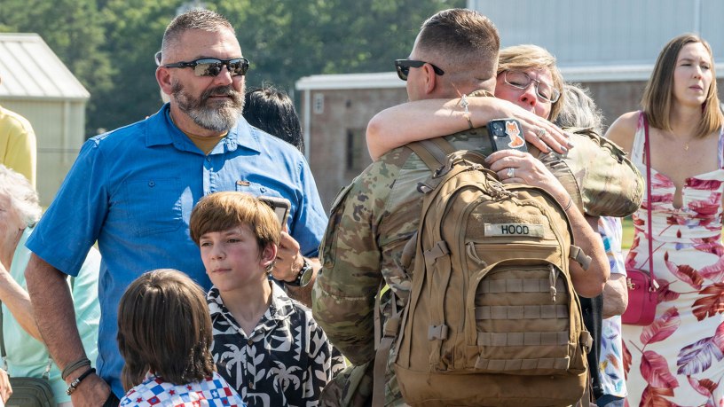 Connecticut National Guard Soldier assigned to 643rd Military Police Company, reunites with his family after returning from deployment at Bradley Air National Guard Base, East Granby, Connecticut, July 11, 2026.