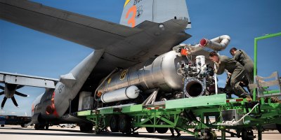 U.S. Air Force loadmasters assigned to the 153rd Airlift Wing guide a Modular Airborne Firefighting System, known as MAFFS, into the cargo bay of a C-130 Hercules at the 153rd Airlift Wing, Wyoming Air National Guard Base, in Cheyenne, Wyoming, July 13, 2026