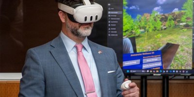 James Perkins, acting program executive officer for the Defense Healthcare Management Systems, is given a demonstration of a virtual reality technology program during the joint Veterans Health Administration and Defense Health Agency’s Immersive Health Care Technology Demo Day at the Washington VA Medical Center in Washington, D.C.