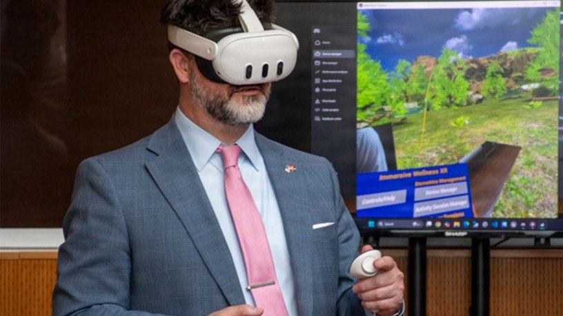 James Perkins, acting program executive officer for the Defense Healthcare Management Systems, is given a demonstration of a virtual reality technology program during the joint Veterans Health Administration and Defense Health Agency’s Immersive Health Care Technology Demo Day at the Washington VA Medical Center in Washington, D.C.