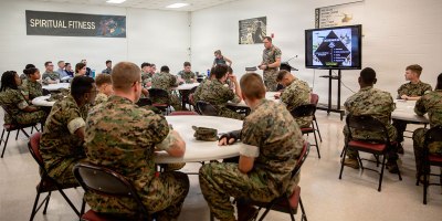 U.S. Navy Lt. Cmdr. Bradford Moore, center right, chaplain, School of Infantry–East, Marine Corps Air Station New River, speaks during a spiritual fitness class at the Spiritual Fitness Center at MCAS New River, North Carolina, July 21, 2026.