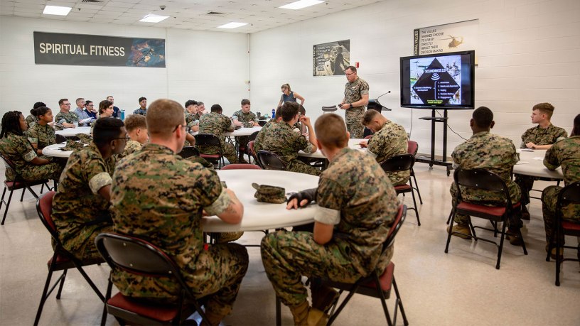 U.S. Navy Lt. Cmdr. Bradford Moore, center right, chaplain, School of Infantry–East, Marine Corps Air Station New River, speaks during a spiritual fitness class at the Spiritual Fitness Center at MCAS New River, North Carolina, July 21, 2026.