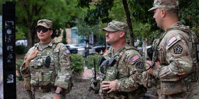 From left, Spc. Carlos Hernandez, Sgt. Joshia Hiott, and Staff Sgt. Tyler Frey, from the South Carolina Army National Guard, assigned to Joint Task Force-District of Columbia, patrol near Eastern Market Metro in Washington, DC, July 21, 2026, in support of the DC Safe and Beautiful mission.