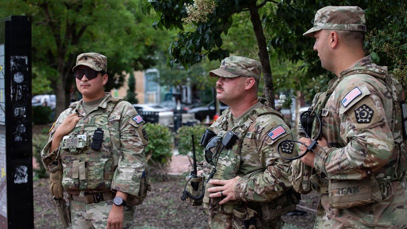 From left, Spc. Carlos Hernandez, Sgt. Joshia Hiott, and Staff Sgt. Tyler Frey, from the South Carolina Army National Guard, assigned to Joint Task Force-District of Columbia, patrol near Eastern Market Metro in Washington, DC, July 21, 2026, in support of the DC Safe and Beautiful mission.