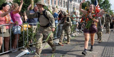 U.S. Air Force Capt. Michael Hubbard, 39th Weapons System Security Group executive officer, high-fives spectators along the route of the 108th International Four Days Marches in Nijmegen, Netherlands, July 24, 2026.