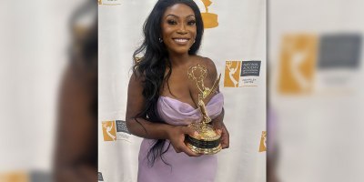 U.S. Air Force Staff Sgt. Tabitha Awoniyi, a Commander's Support Staff member with the 442d Force Support Squadron, 442d Fighter Wing, holds her regional Emmy Award in Louisville, Ky., July 25, 2026.