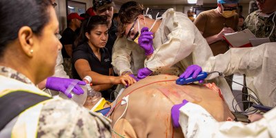 Sailors assigned to the Expeditionary Medical Unit (EMU-2) perform needle thoracostomy on a medical dummy during an Operational Readiness Evaluation (ORE) aboard the expeditionary fast transport ship USNS Point Loma (T-EPF 15), July 25, 2026.