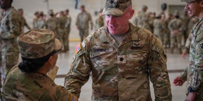 U.S. Army Lt. Col. Christopher Garnett, the outgoing commander of Task Force Talon, shakes hands with a Soldier during a change of command ceremony on Andersen Air Force Base, Guam, July 1, 2026. The ceremony marked a deliberate and ceremonial transfer of leadership, ensuring continuity of command and stewardship of the unit's legacy. (U.S. Army photo by Sgt. Dustin Stark)