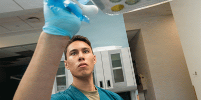 U.S. Army Reserve Soldier Spa. Bradley Rangel, a 68E Dental Specialist with the 491st Medical Company Area Support located in Santa Fe, N.M., a down trace unit of the 807th Theater Medical Command of Salt Lake City, prepares a dental examination light at the Logan Dental Clinic, part of the Alexander T. Augusta Military Medical Center, Fort Belvoir, Va., on Aug. 10, 2026.