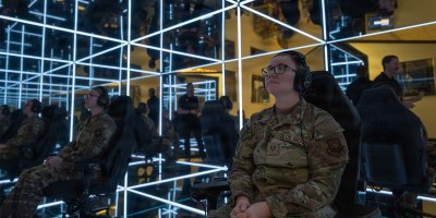 U.S. Air Force Tech. Sgt. Brandie Henrichs, Airman Leadership Instructor, prepares to use the MindGym at Whiteman Air Force Base, Mo., Nov. 20, 2024. The MindGym offers a unique and immersive experience that focuses on reducing stress and promoting relaxation to help improve military readiness. (U.S. Air Force photo by Senior Airman Bryce Moore)