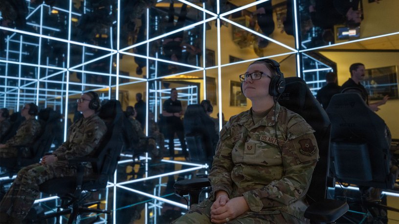 U.S. Air Force Tech. Sgt. Brandie Henrichs, Airman Leadership Instructor, prepares to use the MindGym at Whiteman Air Force Base, Mo., Nov. 20, 2024. The MindGym offers a unique and immersive experience that focuses on reducing stress and promoting relaxation to help improve military readiness. (U.S. Air Force photo by Senior Airman Bryce Moore)