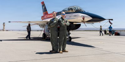 Lt. Col. Philip Downing, 370th Flight Test Squadron commander, and Wei Lee, senior flight test engineer, 418th FLTS, pose after completing a test mission for HAVE HOLIDAYS at Edwards Air Force Base, California, April 29, 2026.