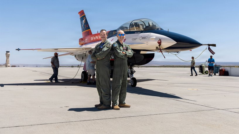 Lt. Col. Philip Downing, 370th Flight Test Squadron commander, and Wei Lee, senior flight test engineer, 418th FLTS, pose after completing a test mission for HAVE HOLIDAYS at Edwards Air Force Base, California, April 29, 2026.