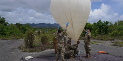 U.S. Army Soldiers assigned to the Extended Range Sensing and Effects Company, 3d Multi-Domain Effects Battalion, 3d Multi-Domain Task Force, inflate a high-altitude balloon at Orote Airfield on Naval Station Guam, June 24, 2026, as part of Exercise Valiant Shield 2026.
