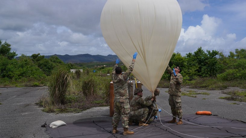 U.S. Army Soldiers assigned to the Extended Range Sensing and Effects Company, 3d Multi-Domain Effects Battalion, 3d Multi-Domain Task Force, inflate a high-altitude balloon at Orote Airfield on Naval Station Guam, June 24, 2026, as part of Exercise Valiant Shield 2026.