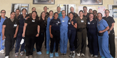 U.S. Airmen assigned to the 944th Aeromedical Staging Squadron and Honduran medical professionals pose for a group photo at Hospital Mario Catarino Rivas during a Medical Readiness Training Exercise in San Pedro Sula, Honduras.