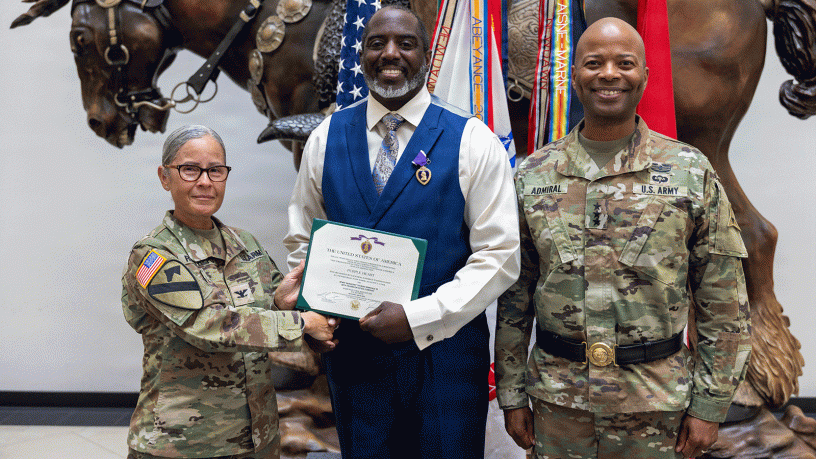 Retired U.S. Army Sgt. 1st Class Thomas Wardale III, center, poses for a photo with Col. Pily Restrepo, deputy commanding officer of the 13th Armored Sustainment Command, left, and Lt. Gen. Kevin D. Admiral, commanding general of III Armored Corps, after receiving the Purple Heart during a ceremony on July 8, at III Armored Corps Headquarters at Fort Hood. (U.S. Army photo by Spc. Patrick M. Connery)