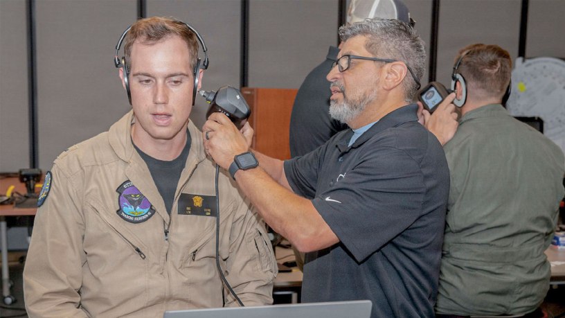 Lt. j.g. Richard Irving, a student naval aviator assigned to the “Stingrays” of (VT) 35, receives an ear-mapping scan during a digital ear scanning ear scan at Naval Air Station (NAS) Corpus Christi, Texas, July 15, 2026.