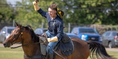 U.S. Army Soldier with the 1st Cavalry Division Horse Detachment demonstrates expert marksmanship on horseback, firing a historic revolver during a weekly mounted demonstration at Fort Cavazos, Texas, July 30, 2026.