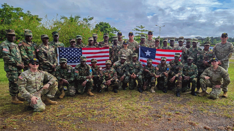 U.S. Army drill sergeant trainers pose for a photo with soldiers of the Armed Forces of Liberia they are training to be drill sergeants at Camp Sande Ware in Careysburg, Liberia, June 15, 2026.