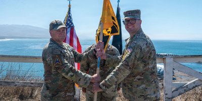 U.S. Space Force Col. James T. Horne III, left, Space Launch Delta 30 commander, passes the ceremonial guidon to Lt. Col. Kyle Rowland, right, 4th Space Launch Squadron incoming commander, during the 4th SLS reactivation ceremony at Vandenberg Space Force Base, California, July 31, 2026.