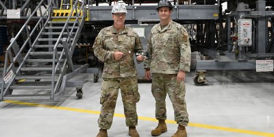 Senior Master Sgt. Chad Bryant (left) and Master Sgt. Tyler Dickson, 512th Maintenance Squadron maintainers, display their creation, a gauge for a variable stator vane lever linkages rigging set for a C-5M Super Galaxy aircraft, at Dover Air Force Base, Delaware, Aug. 1, 2026.