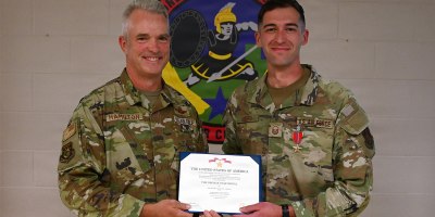 U.S. Air Force Brig. Gen. Darren Hamilton, Ohio National Guard chief of staff, presents the Bronze Star Medal to Master Sgt. Daniel Rogers, an air battle manager asigned to the 123rd Air Control Squadron, during a ceremony Aug. 1, 2026 at Blue Ash Air National Guard Station.