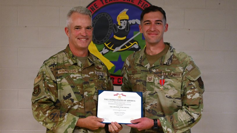 U.S. Air Force Brig. Gen. Darren Hamilton, Ohio National Guard chief of staff, presents the Bronze Star Medal to Master Sgt. Daniel Rogers, an air battle manager asigned to the 123rd Air Control Squadron, during a ceremony Aug. 1, 2026 at Blue Ash Air National Guard Station.