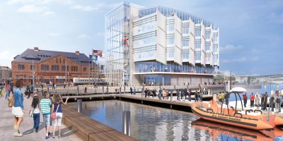 A rendering shows the future National Coast Guard Museum along the Thames River waterfront in New London, Connecticut. The 80,000-square-foot museum, scheduled to open to the public during the week of Aug. 2, 2027, will be the nation’s first national museum dedicated to preserving and sharing the history, heritage and enduring missions of the U.S. Coast Guard. (U.S. Coast Guard rendering)