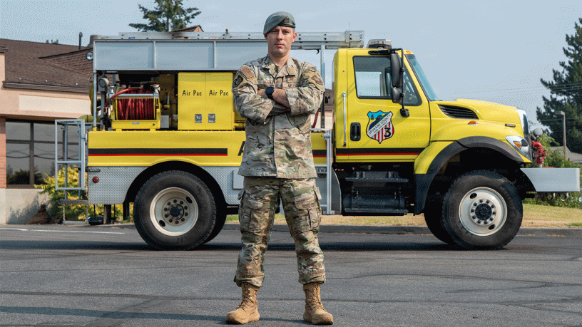 U.S. Air Force Master Sgt. Eric McNair, 92nd Operations Group first sergeant, stands in front of an attack fire apparatus for an environmental portrait at Spokane County Fire District #3, Cheney, Washington, Aug 5., 2026.