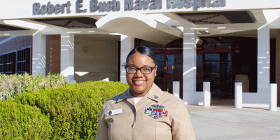 Hospital Corpsman 1st Class Meosha P. Williams, a medical laboratory technician assigned to Navy Medicine Readiness and Training Command Twentynine Palms, poses for a photo in front of Robert E. Bush Naval Hospital, Aug. 7, 2026.