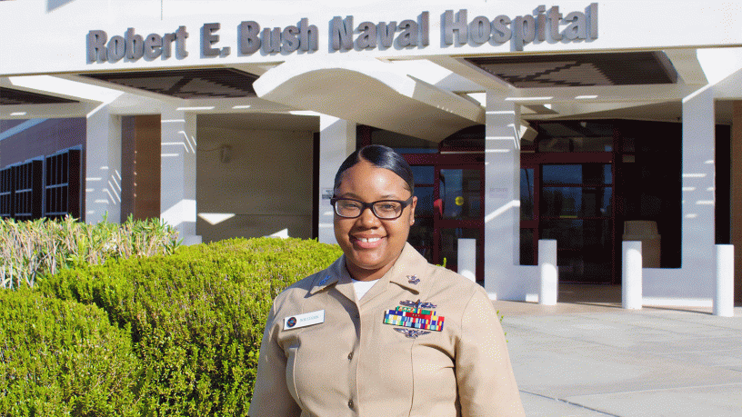 Hospital Corpsman 1st Class Meosha P. Williams, a medical laboratory technician assigned to Navy Medicine Readiness and Training Command Twentynine Palms, poses for a photo in front of Robert E. Bush Naval Hospital, Aug. 7, 2026.