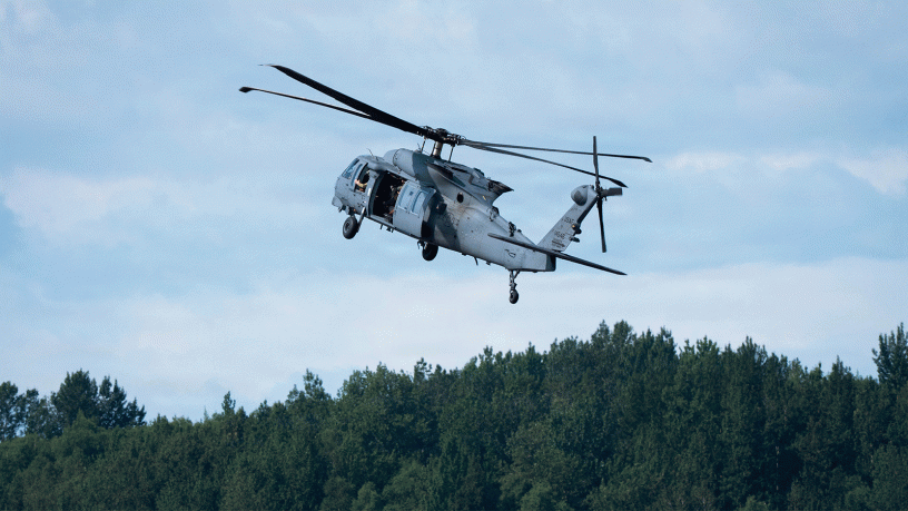A U.S. Air Force HH-60W Jolly Green II helicopter assigned to the 210th Rescue Squadron, Alaska Air National Guard, flies during the Joint Forces Demonstration at the Arctic Thunder Open House at Joint Base Elmendorf-Richardson, Alaska, Aug. 8, 2026.