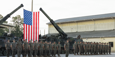 U.S. Marines with Company B, 4th Assault Amphibian Battalion, Marine Forces Reserve, stand in formation during a sundown ceremony for the assault amphibious vehicle, Jacksonville, Florida, August 9, 2026.