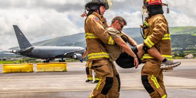U.S. Air Force Master Sgt. David Denlis, a firefighter with the 121st Air Refueling Wing, and the Lajes Field Fire Department, simulate a motor vehicle accident scenario at Lajes Field, Portugal, on August 10, 2026.