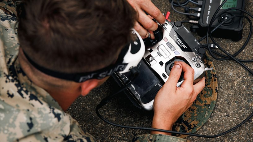 U.S. Marine Corps Lance Cpl. Christian Gillham, a mortarman and team leader with 3rd Littoral Combat Team, 3rd Marine Littoral Regiment, 3rd Marine Division, flies a first-person view unmanned aircraft system for a long-range simulated strike during the Marine Corps Attack Drone Competition at Marine Corps Base Quantico, Virginia, Aug. 11, 2026.