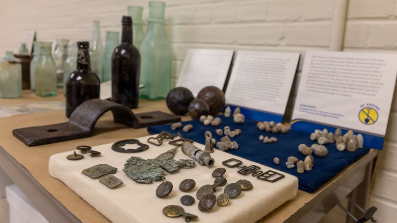 Artifacts are displayed before being packed up and shipped from Naval Air Station (NAS) Pensacola to the University of Georgia. The relocation of these artifacts from NAS Pensacola to the University of Georgia maintains the installation's full compliance with federal archaeological regulations while transporting the material away from potential adverse weather events. (U.S. Navy Photo by Chief Mass Communication Specialist Ian Cotter)