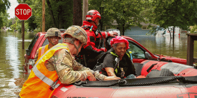 Indiana National Guardsmen with 113th Engineer Battalion assist Indianapolis Fire Department with flood evacuations Aug. 15, 2026 in response to devastating storms that swept through Indiana. (Indiana National Guard photo by Staff Sgt. Christopher Estrada)