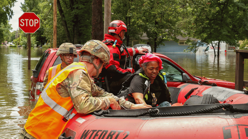 Indiana National Guardsmen with 113th Engineer Battalion assist Indianapolis Fire Department with flood evacuations Aug. 15, 2026 in response to devastating storms that swept through Indiana. (Indiana National Guard photo by Staff Sgt. Christopher Estrada)