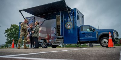 A Soldier assigned to the Connecticut National Guard's 1st Battalion, 102nd Infantry Regiment talks with a member of the Connecticut Department of Veterans Affairs Mobile Medical Team during his Reverse Solider Readiness Processing at Camp Nett, Niantic, Connecticut, Aug. 17, 2026.