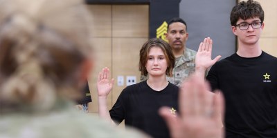 Lance and Riley Qualls take the Oath of Enlistment at the 63rd Readiness Division's Meet Your Army Reserve event in Glendale, AZ August 22.