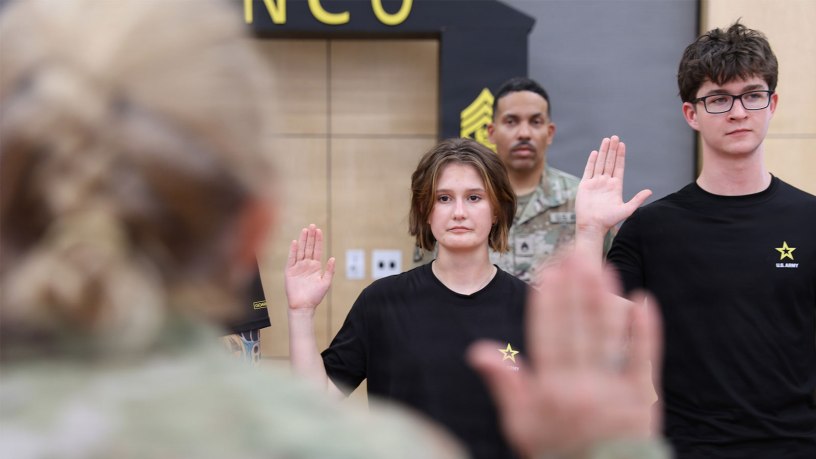 Lance and Riley Qualls take the Oath of Enlistment at the 63rd Readiness Division's Meet Your Army Reserve event in Glendale, AZ August 22.