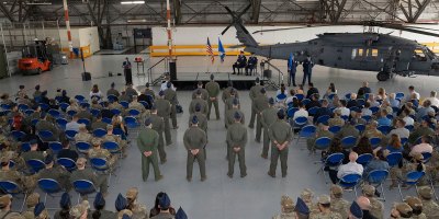 Airmen assigned to the 1st Helicopter Squadron stand in formation during the 5th Helicopter Squadron activation ceremony at Joint Base Andrews, Md., Aug. 27, 2026. Airmen in the formation were re-patched to signify the activation of the 5 HS that now stands alongside the 1 HS. (U.S. Air Force photo by Airman 1st Class Mauricio Hidalgo)
