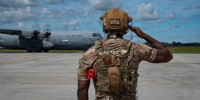 A U.S. Air Force technical sergeant, 172nd Airlift Wing, marshals an aircraft at Karup Air Base, Denmark, June 18, 2026. The wing was recognized as one of 13 military programs for their commitment and innovation in outstanding suicide prevention efforts to save lives at the 2026 Suicide Prevention Recognition Ceremony Sept. 2 at the Pentagon, presented by Defense Suicide Prevention Office.
