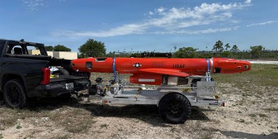 An aerial target drone rests on a recovery trailer at Tyndall Air Force Base, Florida. The 53rd Test Support Squadron developed the mobile recovery capability to streamline the recovery and transportation of aerial target drones used to support Air Force weapons testing and evaluation.