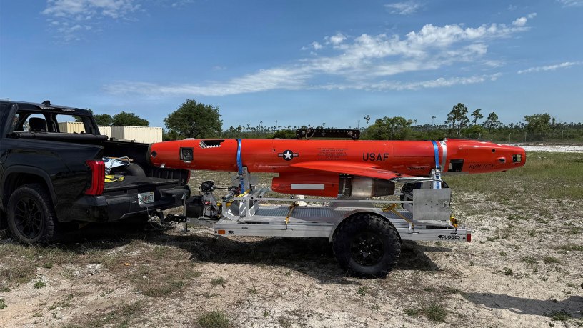 An aerial target drone rests on a recovery trailer at Tyndall Air Force Base, Florida. The 53rd Test Support Squadron developed the mobile recovery capability to streamline the recovery and transportation of aerial target drones used to support Air Force weapons testing and evaluation.