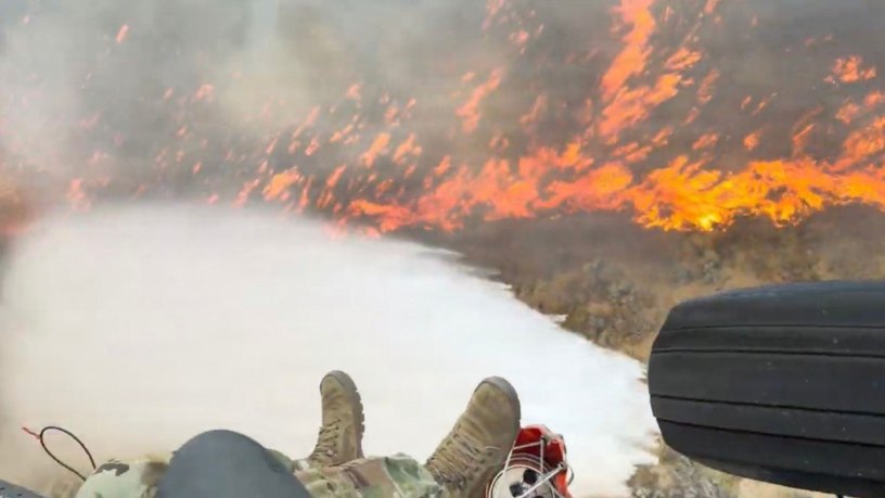 This screen grab from a video captures a water drop over the Bug Fire north of Reno on Aug. 11, 2026. More than 13,000 residents were evacuated and tens of thousands more were set to evacuate the valleys just north of Reno during last week’s Bug, Stallion and Fred Mountain fires. Eleven structures were lost, but fire predictions forecast far worse outcomes immediately following its ignition Aug. 9. (Capt. Emerson Marcus)