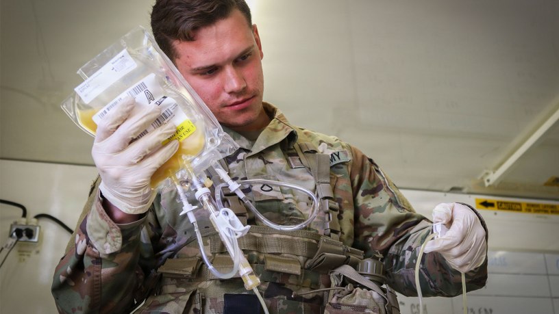 U.S. Army Pfc. Jaritt Louthan, a medical lab technician with 432nd Blood Support Detachment, 28th Combat Support Hospital, 44th Medical Brigade, and a native of Cleveland, re-hydrates prototype Freeze-Dried Plasma during an airdrop test Sept. 19, 2019 at Fort Bragg, N.C.
