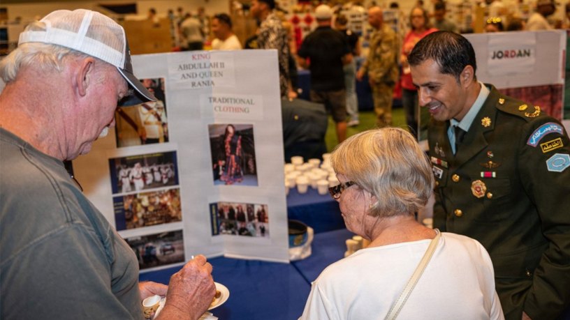 Maj. Mohammad Elturshan, an international student from Jordan, shares traditional food with visitors to his booth at the 2023 Know Your World event, hosted by the International Military Student at Nutter Field House. This year’s event is scheduled to take place from 6 to 8 p.m., Oct. 2, 2026, at Nutter Field House.